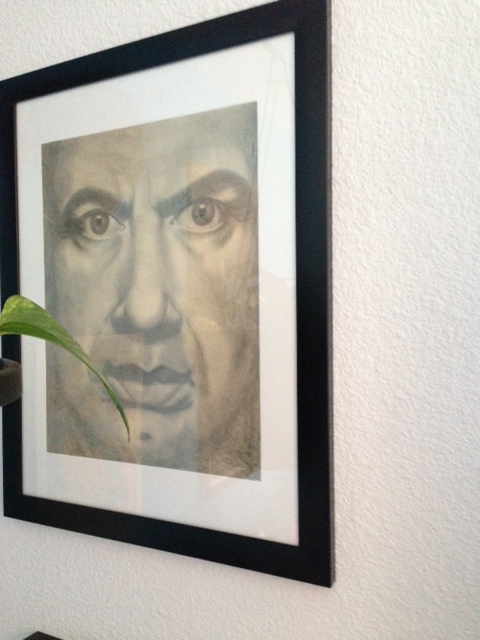 Forgive the odd angle. He's sort of hiding behind a plant. Not that I hid my own art behind a plant. Very interesting.
